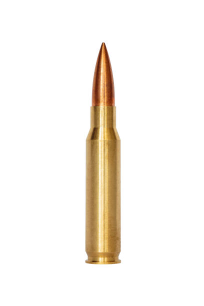 A rifle bullet over white background A rifle bullet over white background bullet cartridge photos stock pictures, royalty-free photos & images