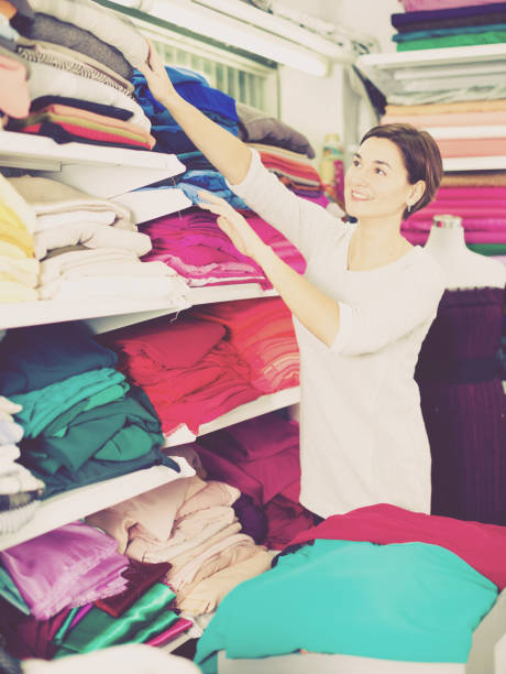 istock Woman choosing fabric 1066916878