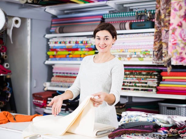 istock Seller showing white fabric 1066916884