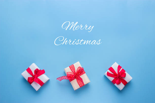 istock christmas presents concept image. boxes with red ribbons 1066924740