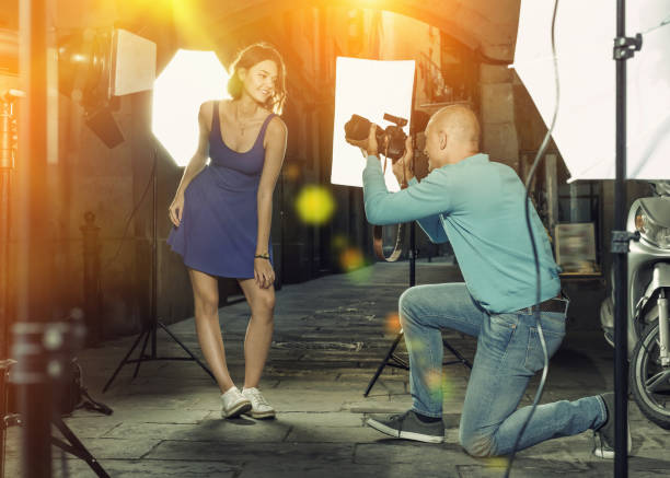 istock Professional photo shooting outdoors. Attractive female model po 1066925086