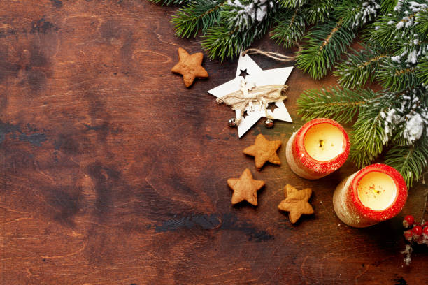 istock Christmas candles and fir tree branch 1066925228