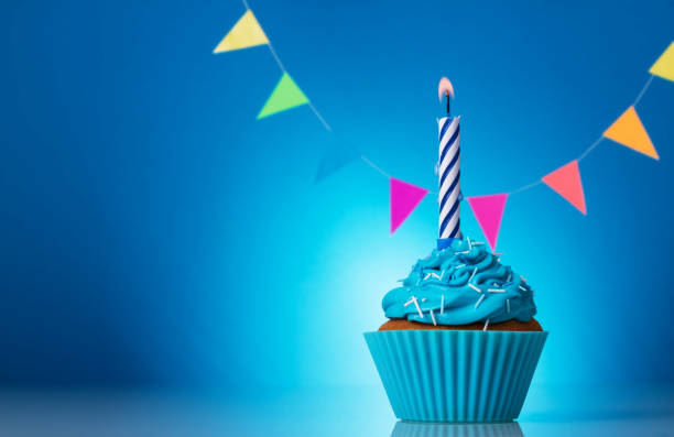 istock Cupcake birthday beautiful on a bright blue background 1066925936