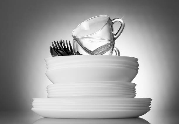 istock Clean plates and cutlery on beautiful gray background 1066926112