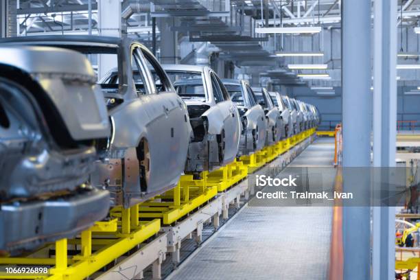 Movement Of Vehicles Along The Production Line At The Plant Car Assembly Shop Car Assembly By Parts Stock Photo - Download Image Now