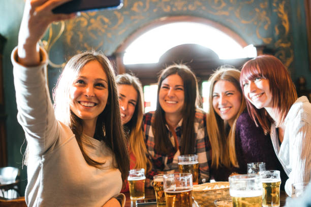 friends selfie at the pub - irish culture beer drinking pub imagens e fotografias de stock