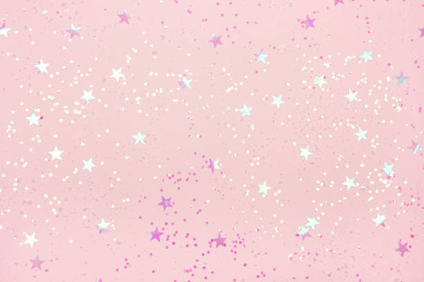 istock Pink Christmas background with confetti. 1066929388