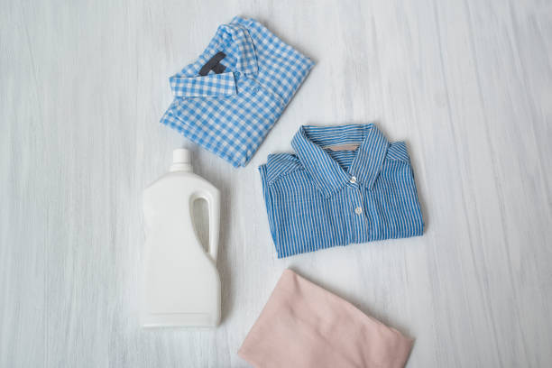 istock Clothes and bottle with detergent. Top view 1066932032