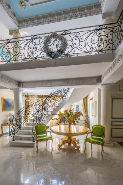 istock luxury lobby interior. Staircase with handmade wrought Iron Railing 1066933698