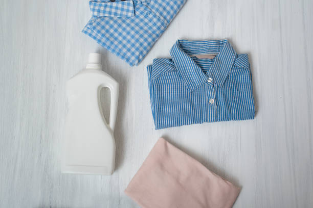 istock Clothes and bottle with detergent. Top view 1066935288