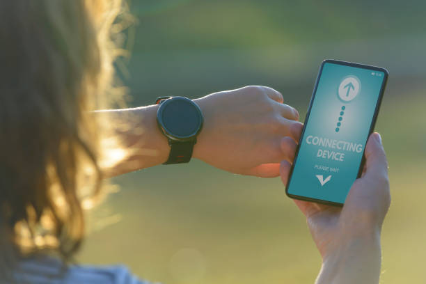 istock Woman is using the smartwatch and smart phone 1066935926