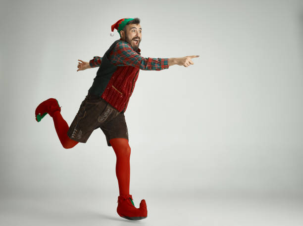 istock friendly man dressed like a funny gnome posing on an isolated gray background 1066938418