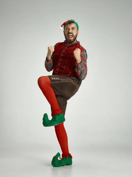 istock friendly man dressed like a funny gnome posing on an isolated gray background 1066938420
