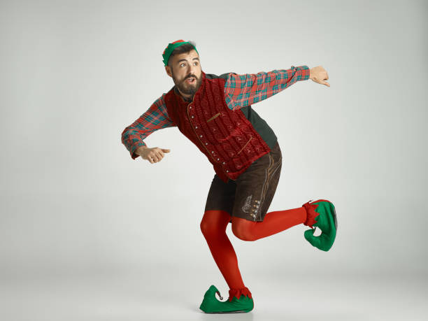istock friendly man dressed like a funny gnome posing on an isolated gray background 1066938436