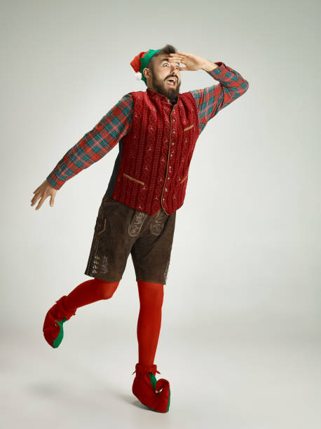 istock friendly man dressed like a funny gnome posing on an isolated gray background 1066938450