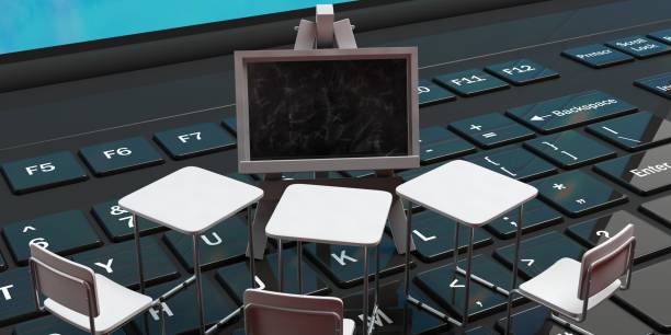 istock School desks and a blackboard on a black laptop computer keyboard, 3d illustration. 1066939046