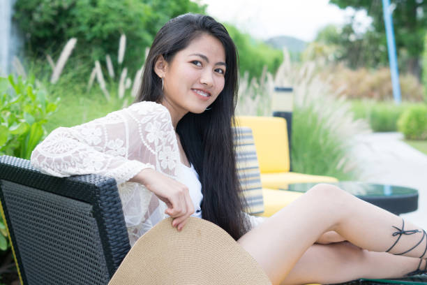 istock Relaxing woman sitting comfortable in sofa lounge chair 1066941264