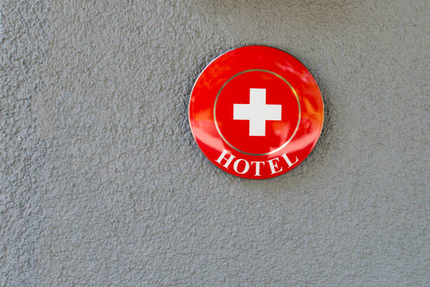 Mürren/Switzerland - August 27 2015: Swiss flag on a hotel sign in Mürren, Switzerland.