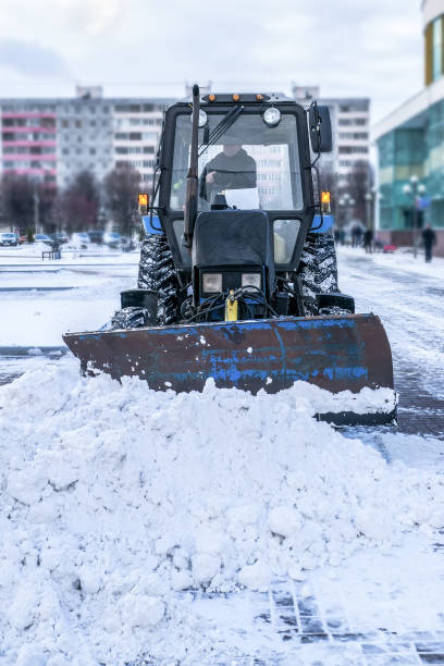 istock Blue bulldozer cleans the streets after a heavy natural snowfall. 1066943020