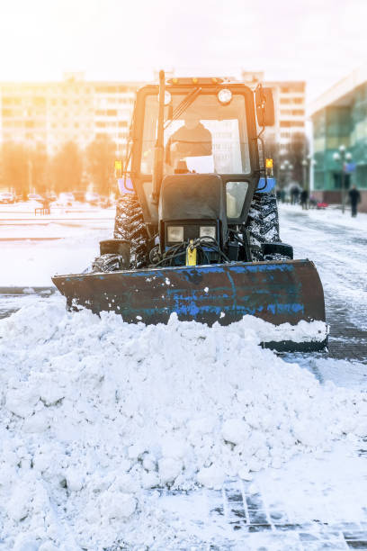 istock Blue bulldozer cleans the streets after a heavy natural snowfall. 1066943048