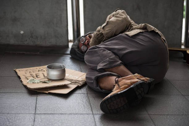 istock Old homeless man sleep on footpath 1066944076