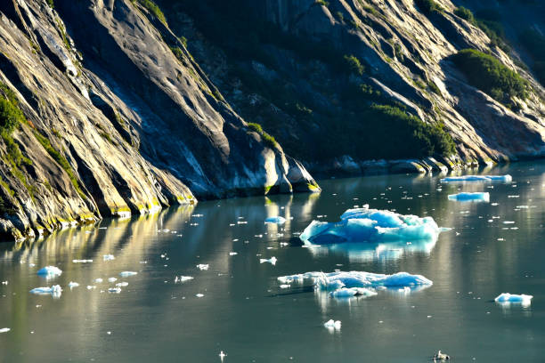 istock Blue Iceberg against colorful rocks 1066945354
