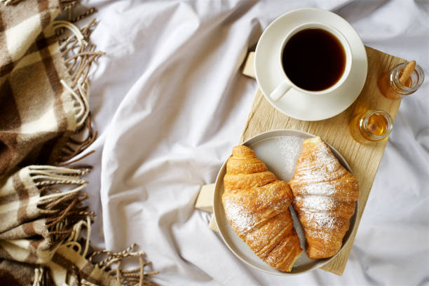 istock Croissants and coffee for breakfast in bed 1066947628