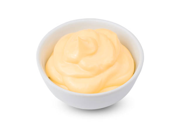 istock One Bowl with tasty cheese sauce on white background 1066948164