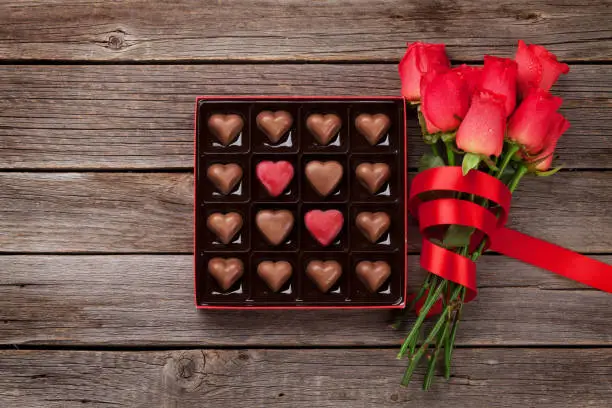 Photo of Red roses and chocolate box