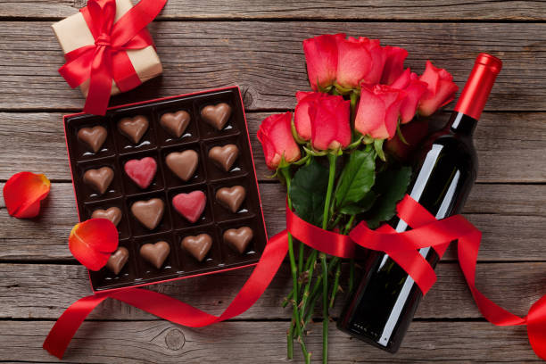 istock Red roses, wine bottle and chocolate box 1066949868