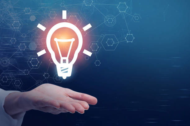 istock Woman hand with glowing light bulb, idea 1066950228