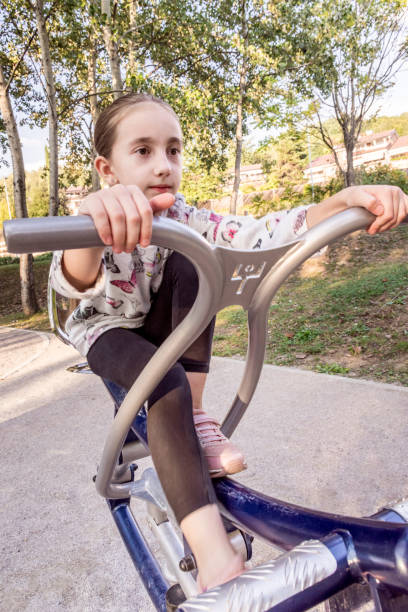 istock Girl Exercising on Exercise Equipment at Park 1066951150