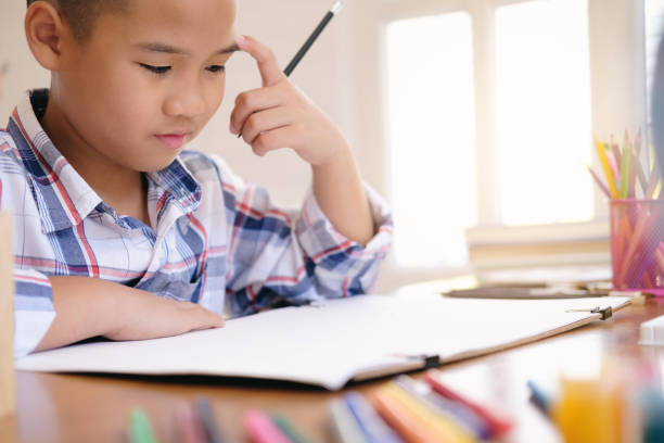 istock Child boy drawing picture at home. 1066954164