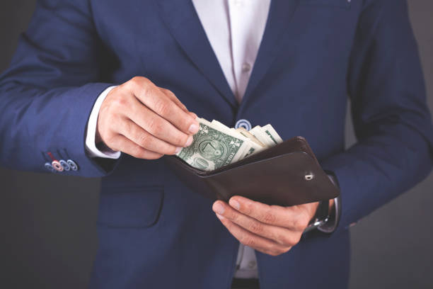istock young business man hand  money with  wallet 1066955738