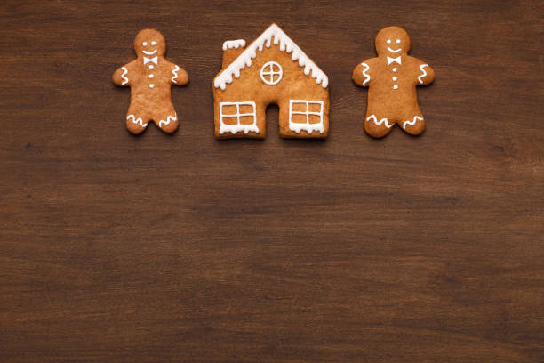 istock Christmas homemade gingermen and house, copy space 1066956762