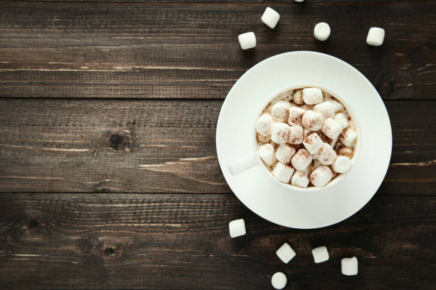 istock Cappuccino with marshmallows in cup on wooden table 1066963440