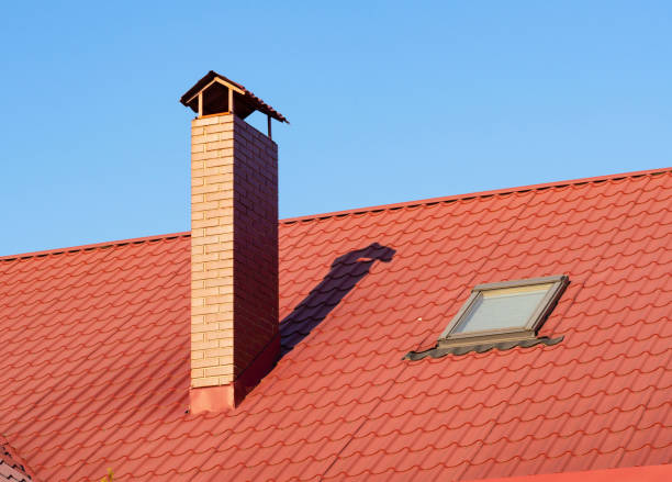istock Brick chimney with skylight on the terracotta rooftop, closeup 1066964672