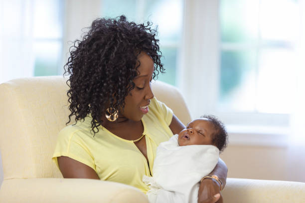 istock A mom gazes at her newborn baby 1066964726
