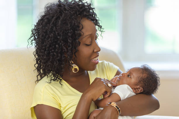istock New mom smiling at her baby 1066964758