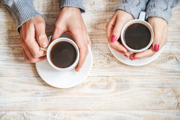 istock Cup drink for Breakfast in the hands of lovers. Selective focus. 1066965660