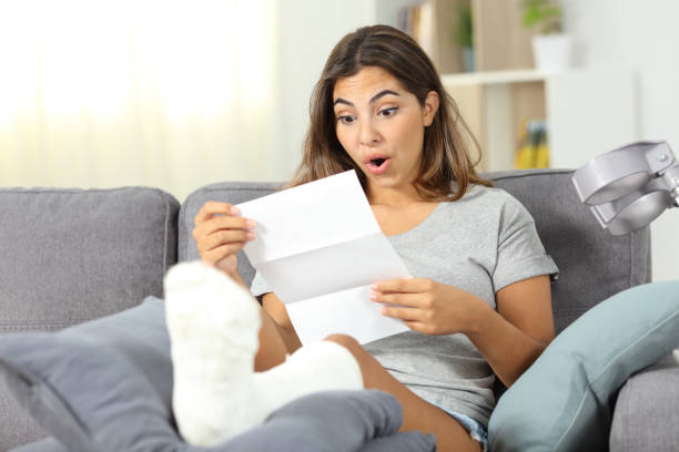 istock Surprised disabled girl reading notification 1066966790