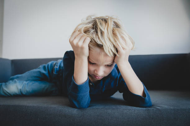 istock sad child, stress and depression, anxiety, feeling weak and tired 1066969434