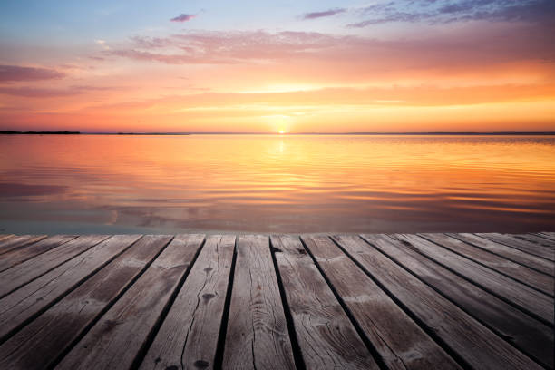 istock Colorful beautiful cloudy sunset over ocean horizon 1066972986