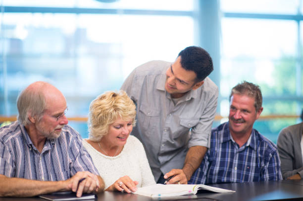 istock Professor advises group of older students 1066973592