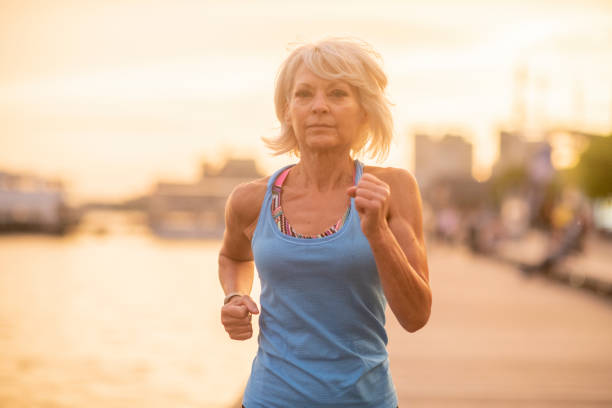 istock Senior lady on an evening jog 1066974466