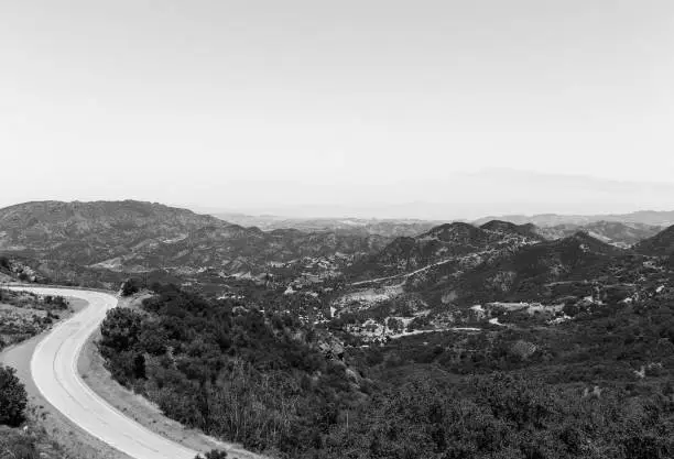 The Mulholland Highway in Los Angeles near Rocky Oaks Park in black and white.