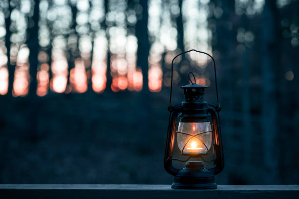 istock Retro style vintage old metal lantern at night 1066976594