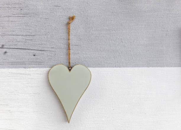 istock Wooden heart over wall scratched white background 1066976606