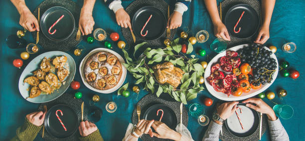 istock People ready to celebrate Christmas party dinner, wide composition 1066977850