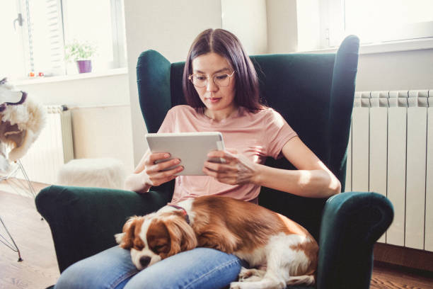 istock woman relaxing at home using her tablet 1066979690